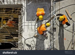 stock-photo-construction-site-workers-aerial-top-view-406114573