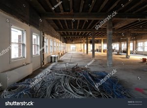 stock-photo-unused-cabling-from-an-interior-commercial-office-remodel-one-point-perspective-preparing-for-an-28463506